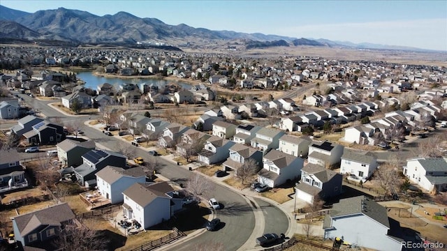 birds eye view of property featuring a residential view and a water and mountain view