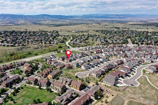4090 Forever Cir, Castle Rock, CO 80109 - aerial overview of property's location featuring a mountainous background and nearby suburban area