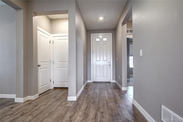4090 Forever Cir, Castle Rock, CO 80109 - foyer featuring dark wood-style floors, baseboards, and a textured wall