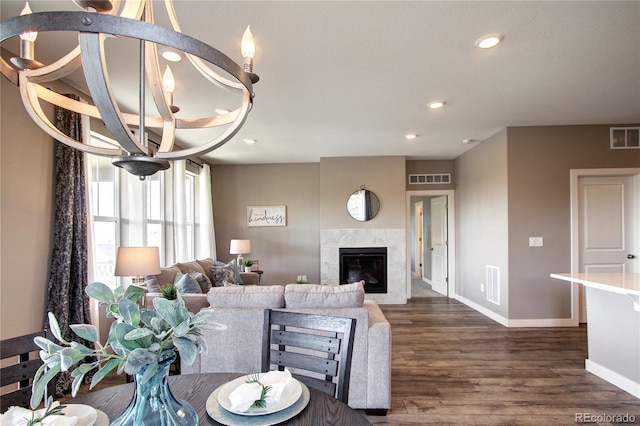 4090 Forever Cir, Castle Rock, CO 80109 - living room featuring dark wood-style flooring, a chandelier, baseboards, a fireplace, and recessed lighting