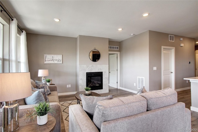 4090 Forever Cir, Castle Rock, CO 80109 - living room with wood finished floors, a premium fireplace, baseboards, and recessed lighting