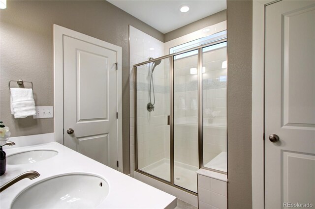 4090 Forever Cir, Castle Rock, CO 80109 - bathroom with a stall shower and double vanity