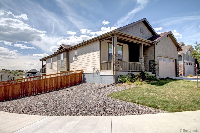 4090 Forever Cir, Castle Rock, CO 80109 - view of front of property featuring a porch, a garage, and stone siding