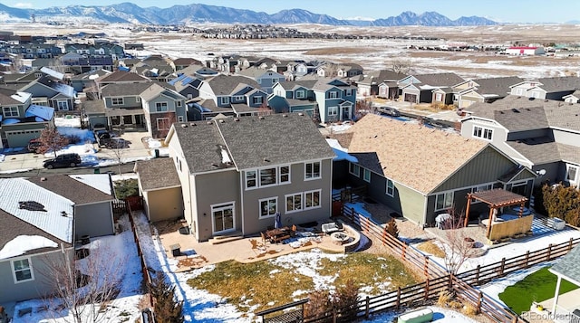 snowy aerial view with a mountain view