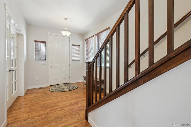 entryway with light hardwood / wood-style flooring