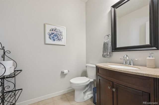 bathroom with tile patterned floors, toilet, and vanity