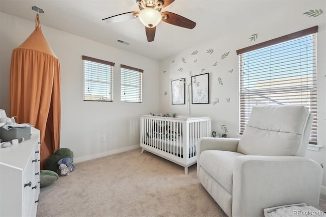 carpeted bedroom featuring ceiling fan