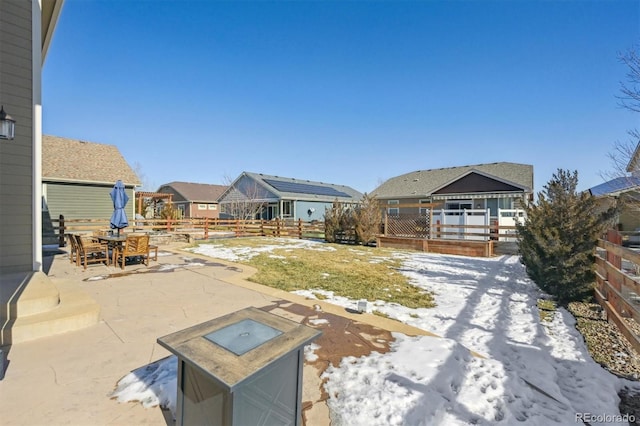 view of snow covered patio