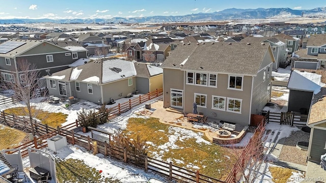 snowy aerial view with a mountain view