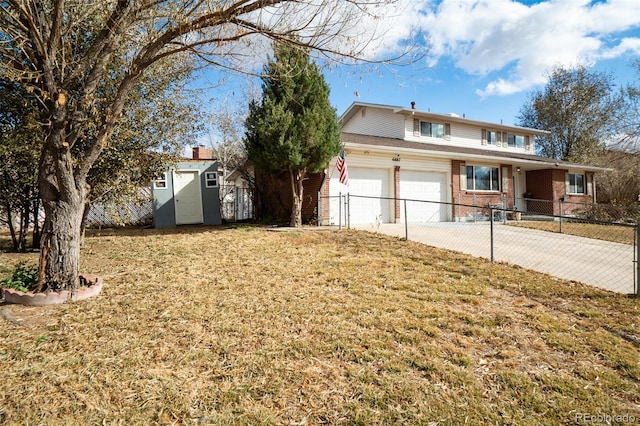 traditional home featuring concrete driveway, brick siding, fence, and a storage shed