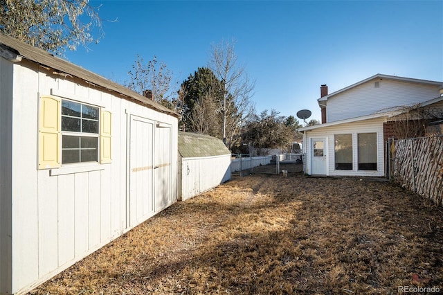 view of yard with an outdoor structure and fence private yard