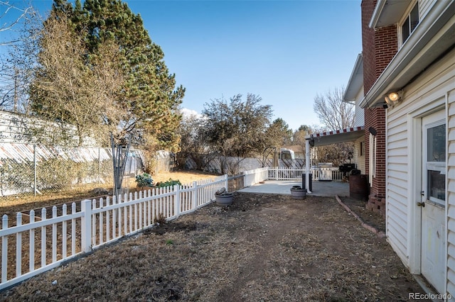 view of yard with a fenced backyard and a patio