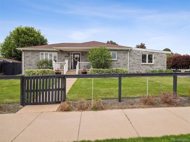 2945 E 26th Avenue Parkway, Denver, CO 80205 - ranch-style house with brick siding and a gate