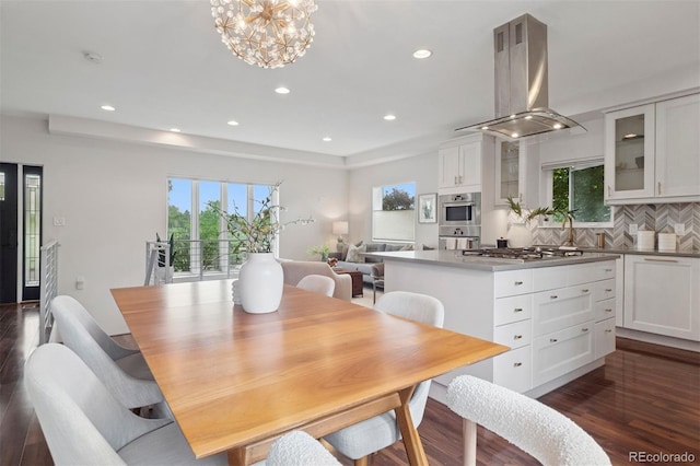2945 E 26th Avenue Parkway, Denver, CO 80205 - dining area with healthy amount of natural light, dark wood-type flooring, recessed lighting, and a chandelier