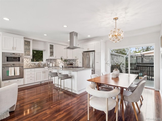 2945 E 26th Avenue Parkway, Denver, CO 80205 - dining area featuring dark wood finished floors, recessed lighting, and a chandelier