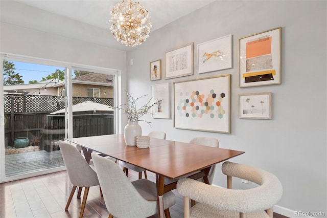 2945 E 26th Avenue Parkway, Denver, CO 80205 - dining space with a chandelier and wood finished floors