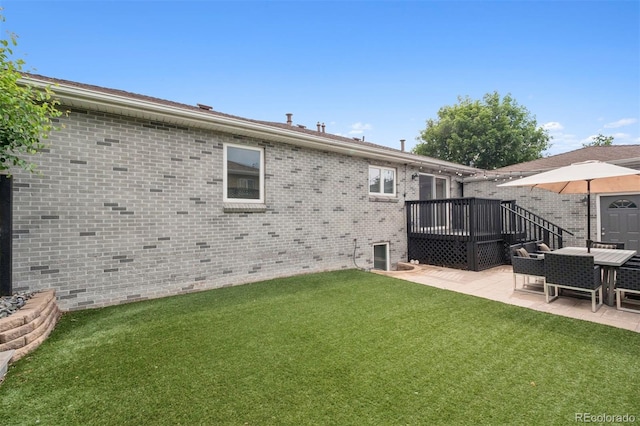 2945 E 26th Avenue Parkway, Denver, CO 80205 - rear view of house featuring a patio, a yard, a deck, and brick siding