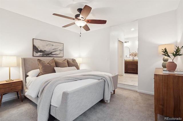 2945 E 26th Avenue Parkway, Denver, CO 80205 - bedroom with light colored carpet, ensuite bath, baseboards, and ceiling fan