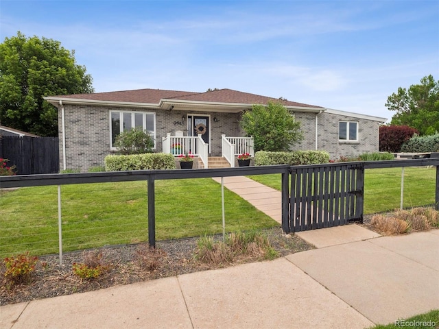 2945 E 26th Avenue Parkway, Denver, CO 80205 - view of front of home featuring brick siding and a gate