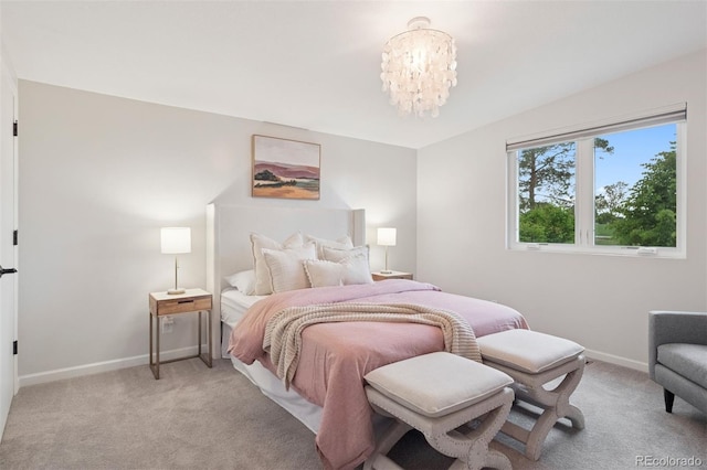 2945 E 26th Avenue Parkway, Denver, CO 80205 - bedroom with light colored carpet, baseboards, and a chandelier