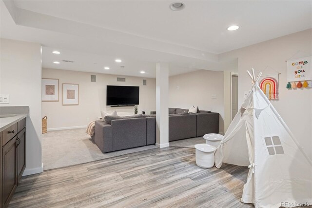 2945 E 26th Avenue Parkway, Denver, CO 80205 - living room with light wood finished floors, recessed lighting, and baseboards