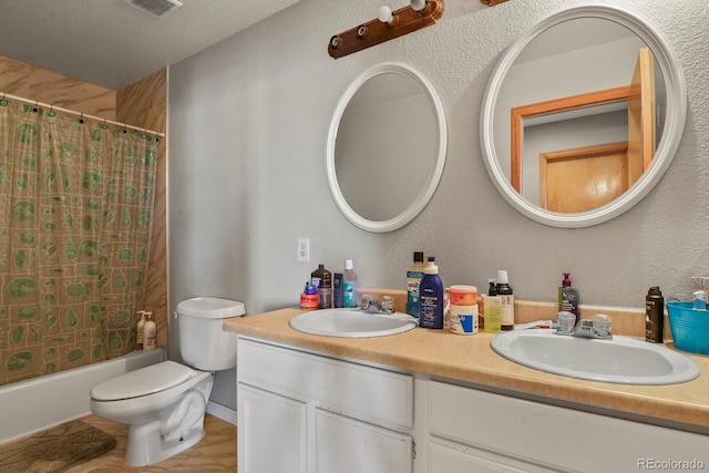 full bathroom with toilet, vanity, and shower / tub combo with curtain