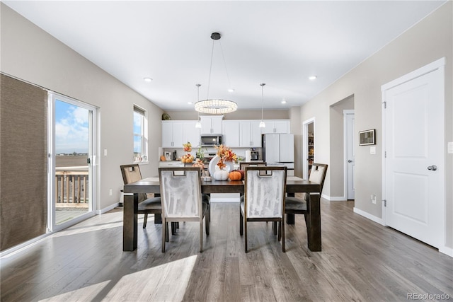 dining area featuring hardwood / wood-style flooring