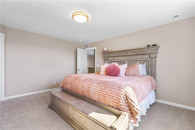 bedroom featuring light carpet