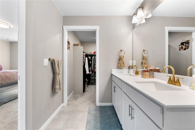 bathroom with vanity and tile patterned floors