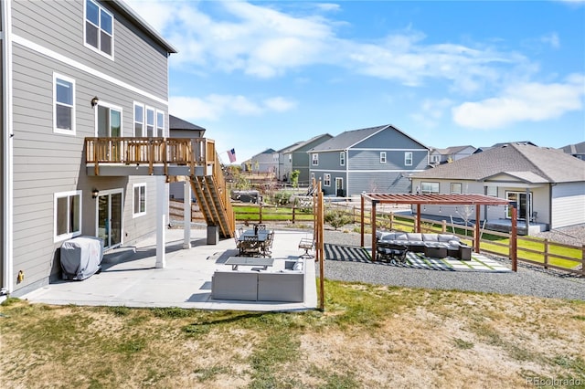 view of yard featuring a wooden deck, a patio area, and outdoor lounge area