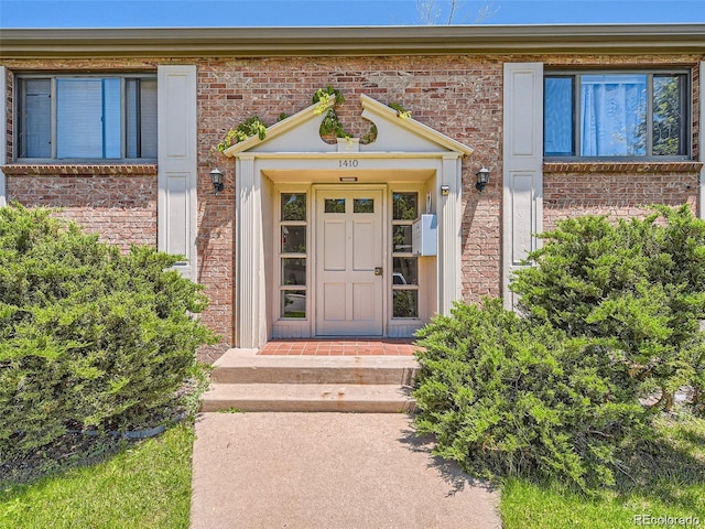 1410 S Ash St, Denver, CO 80222 - property entrance featuring brick siding