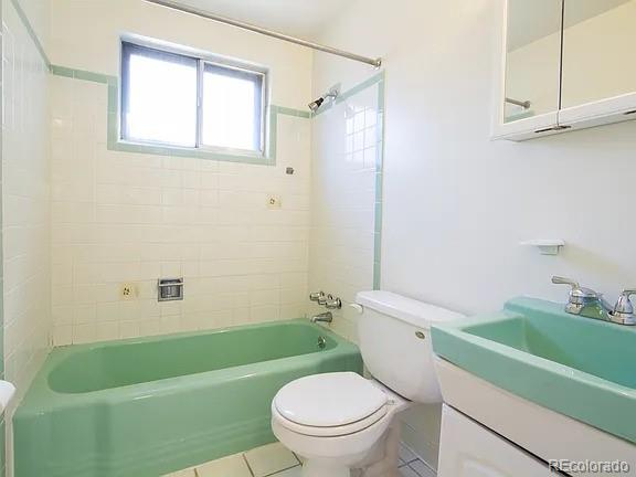 1410 S Ash St, Denver, CO 80222 - bathroom with vanity, tile patterned floors, bathtub / shower combination, and toilet