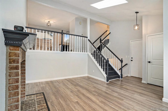 stairs featuring wood-type flooring