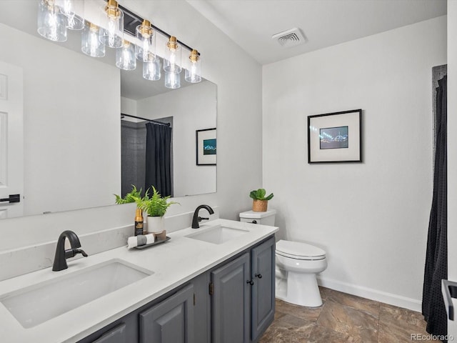 7379 S Gore Range Rd Unit 304, Littleton, CO 80127 - bathroom with stone finish floors, double vanity, and a shower with shower curtain