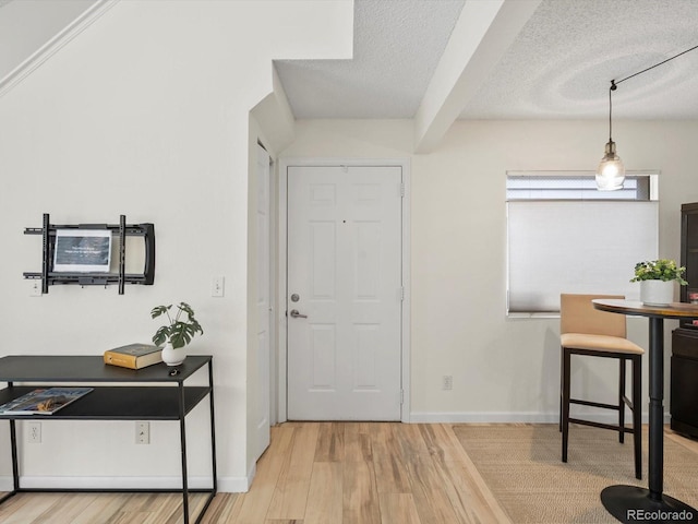 7379 S Gore Range Rd Unit 304, Littleton, CO 80127 - entrance foyer with wood finished floors and a textured ceiling