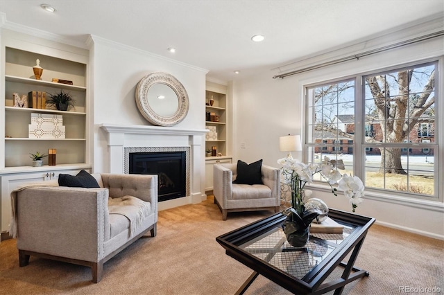 living room featuring light carpet, built in features, a wealth of natural light, and a fireplace