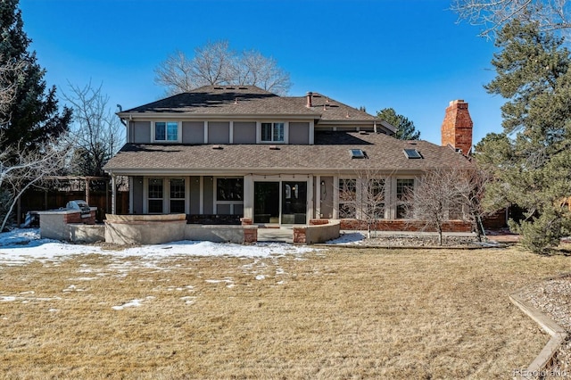 snow covered property featuring a yard