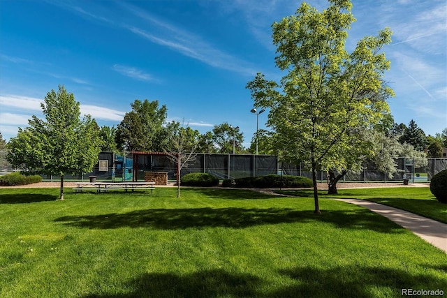 surrounding community featuring a yard and a playground