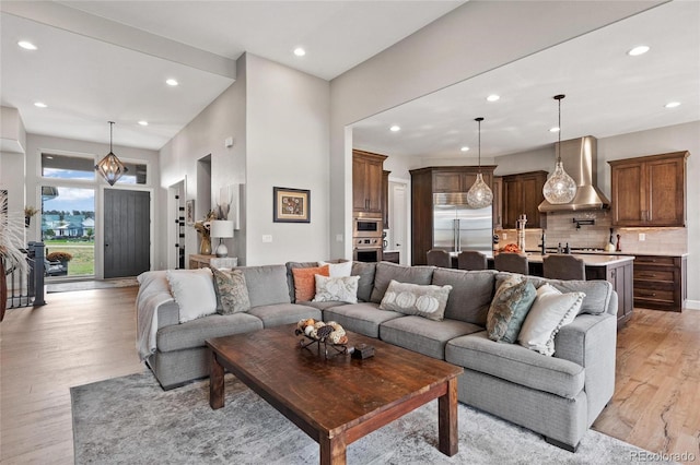 living room featuring recessed lighting and light wood-type flooring