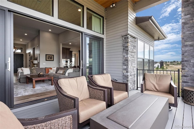 deck featuring outdoor lounge area