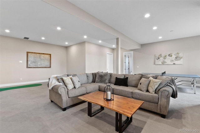 living area with recessed lighting, light colored carpet, visible vents, and baseboards