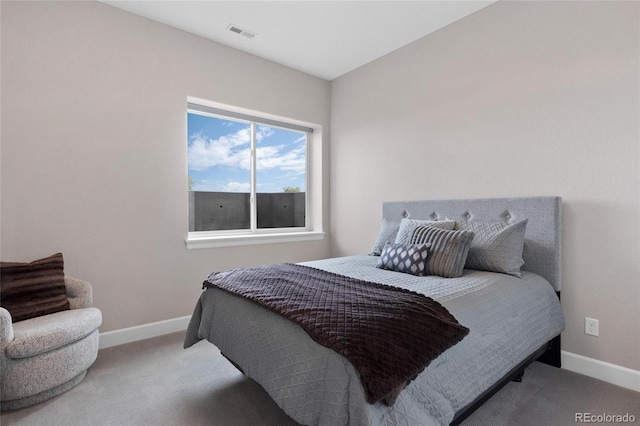 bedroom featuring visible vents, baseboards, and carpet flooring