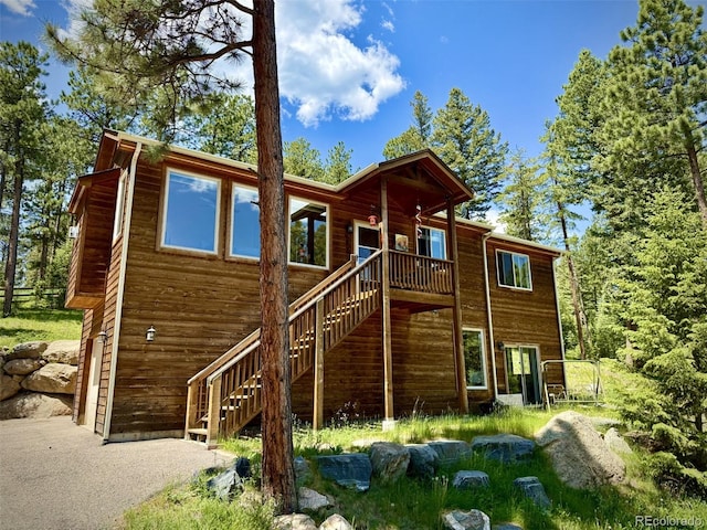 6752 S Columbine Rd, Evergreen, CO 80439 - rear view of property with stairway