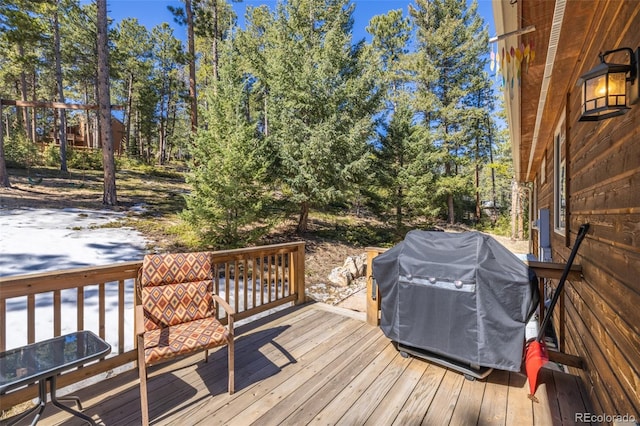 6752 S Columbine Rd, Evergreen, CO 80439 - wooden terrace featuring a grill