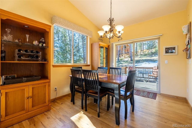 6752 S Columbine Rd, Evergreen, CO 80439 - dining space featuring a chandelier, light wood-style flooring, and vaulted ceiling