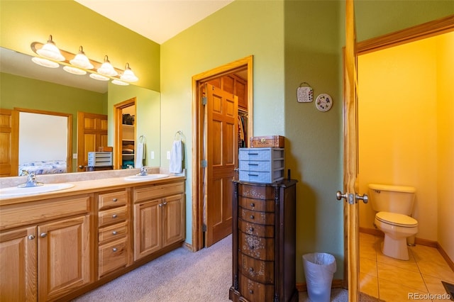 6752 S Columbine Rd, Evergreen, CO 80439 - bathroom with double vanity and tile patterned floors