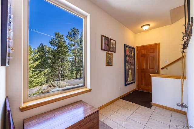 6752 S Columbine Rd, Evergreen, CO 80439 - foyer entrance with baseboards and light tile patterned floors