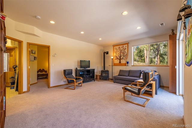 6752 S Columbine Rd, Evergreen, CO 80439 - carpeted living area featuring recessed lighting and a wood stove