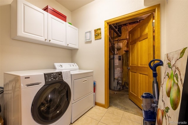 6752 S Columbine Rd, Evergreen, CO 80439 - laundry room featuring water heater, independent washer and dryer, cabinet space, and light tile patterned floors