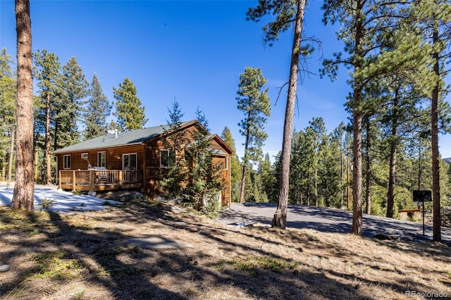 6752 S Columbine Rd, Evergreen, CO 80439 - view of side of property featuring a wooden deck